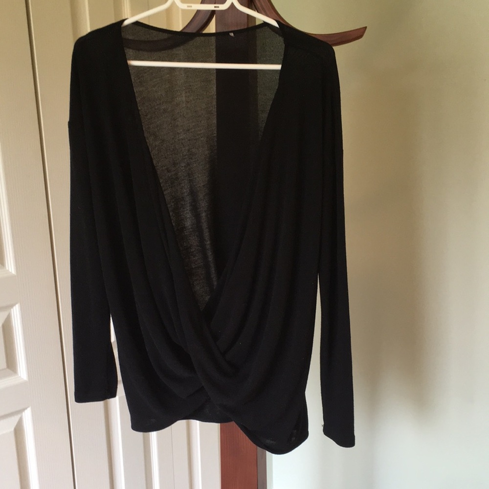 Black sweater cross drape